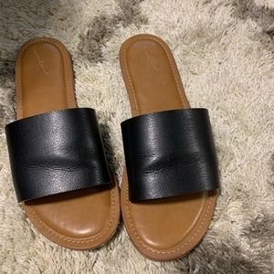 Gently used black slide on sandals